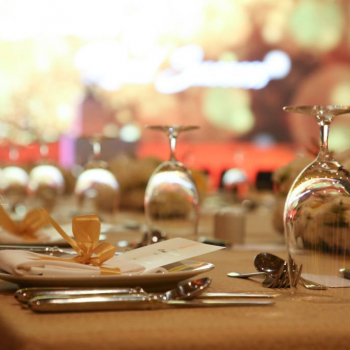 Table decoration for dinner party celebration in golden light